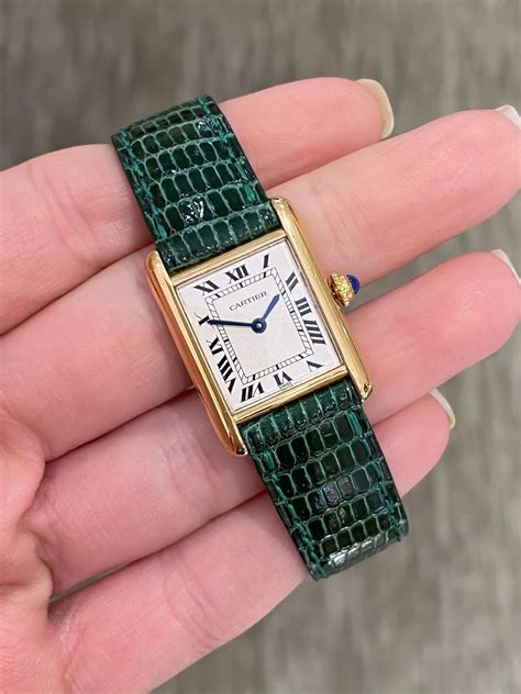 cartier green leather strap.